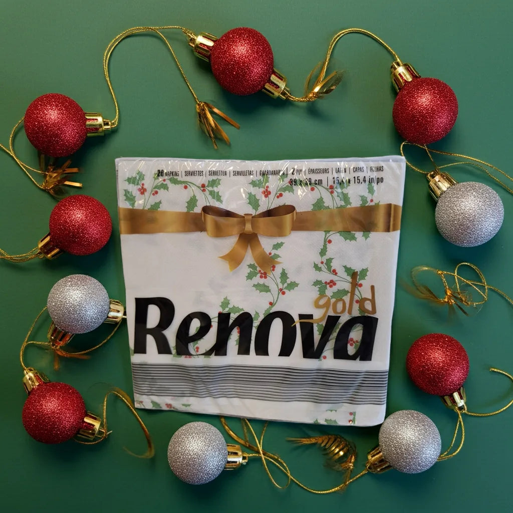 Pacote de guardanapos de Natal 40x40 Renova Gold rodeado de bolas de Natal